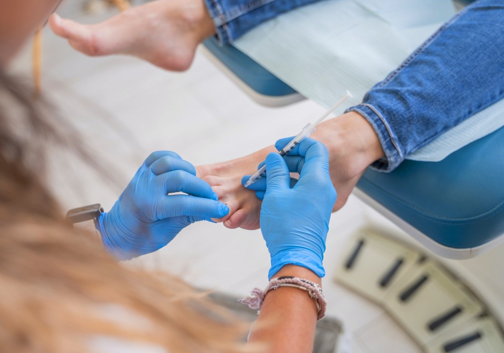 Foto pie pinchando aguja